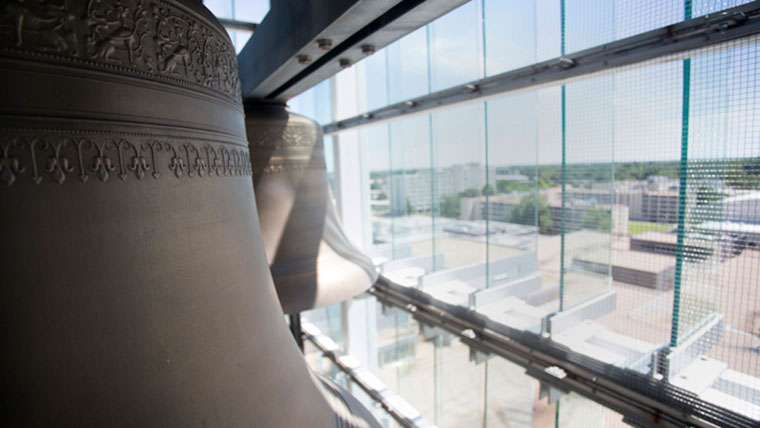 Bell in tower overlooking campus.